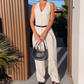 🩷Dames halternek jumpsuit met diepe V-hals en wijde pijpen🌸