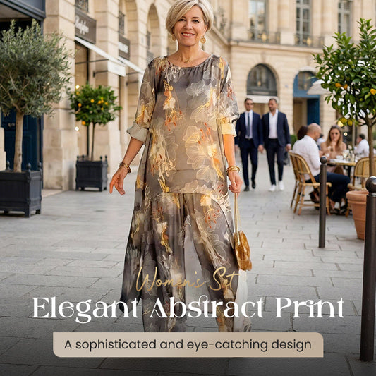 Damesset bestaande uit een asymmetrische tuniek en broek met bloemenprint.